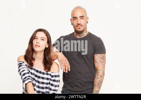 Couple posing together in a studio setting. Stock Photo