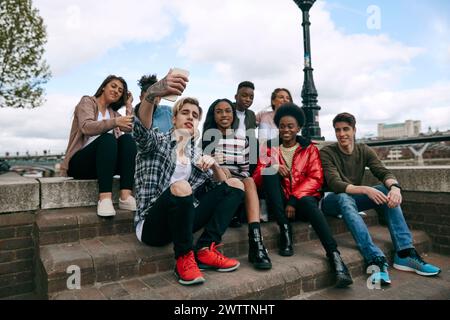 Group of friends taking a selfie outdoors Stock Photo