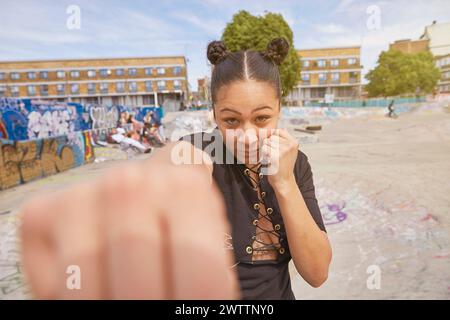 Woman posing with a playful fist to the camera Stock Photo