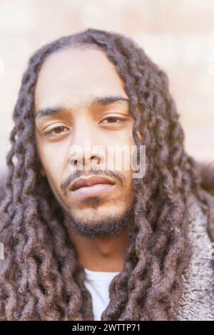 Portrait of a man with long curly hair. Stock Photo