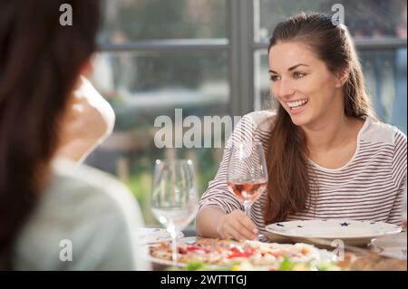 Two women enjoying a meal together Stock Photo