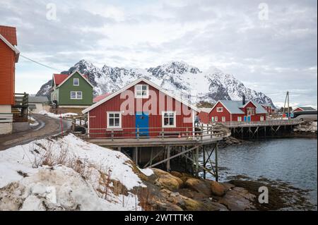 Scenic view of traditional red norwegian houses in the fishing village of Henningsvær on Lofoten islands, northern Norway. Stock Photo