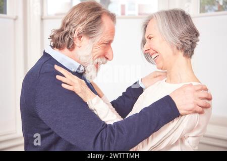 Elderly couple sharing a joyful moment Stock Photo