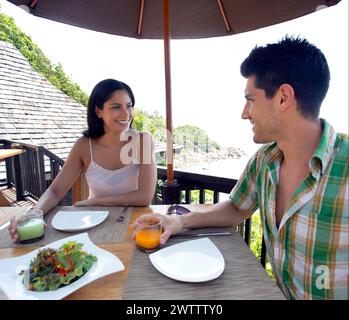 Couple enjoying a meal with a sea view Stock Photo