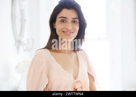 Smiling woman in a bright room Stock Photo