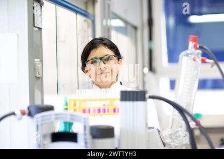 Confident scientist with a bright smile in a lab environment. Stock Photo