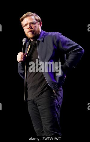 Rob Beckett on stage during A Night of Comedy, the Teenage Cancer Trust show at the Royal Albert Hall, London. Picture date: Tuesday March 19, 2024. Stock Photo