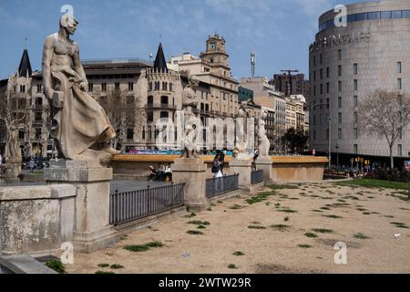 Barcelona, Spain. 19th Mar, 2024. A large dry land due to lack of irrigation is seen in Plaza de Catalunya. As a consequence of water restrictions due to drought and despite the efforts of Barcelona City Council to keep garden areas in good irrigation conditions with groundwater, drought is visible in a large part of the public garden areas of Barcelona. (Photo by Paco Freire/SOPA Images/Sipa USA) Credit: Sipa USA/Alamy Live News Stock Photo
