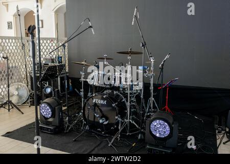 a Live music stage setup with drum set and professional lighting, ready for performance Stock Photo