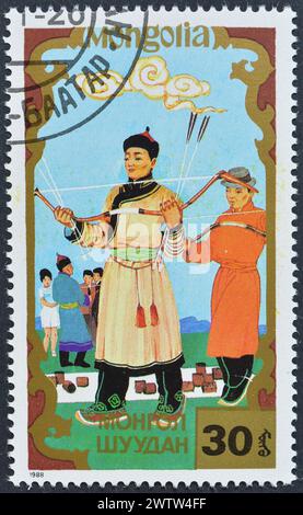 Cancelled postage stamp printed by Mongolia, that shows Traditional Sports, circa 1988. Stock Photo