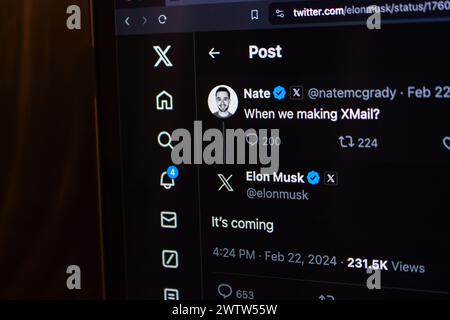 Vancouver, CANADA - Mar 18 2024 : In the X app, a user posted “When we making XMail?”, to which Elon Musk responded, “It’s coming”, seen in a laptop Stock Photo
