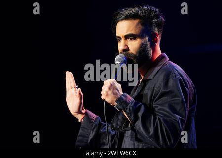 Paul Chowdhry on stage during A Night of Comedy, the Teenage Cancer Trust show at the Royal Albert Hall, London. Picture date: Tuesday March 19, 2024. Stock Photo