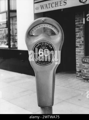 Close-up of an old manual parking meter on the street of our retail district in town Stock Photo