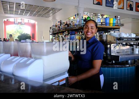 A female bartender preparing mixed cocktails in the lobby bar in Ocean Blue & Sand Resort. Punta Cana. Dominican Republic Stock Photo