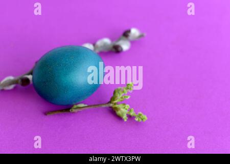 The attributes of the festival of the Resurrection of Christ are colored chicken eggs, willow branches and candles. Stock Photo