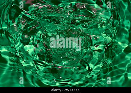 Numerous circles formed on the surface of the water from the falling drops. Stock Photo