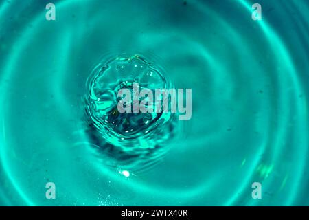 Circles on the surface of the water from falling drops Stock Photo