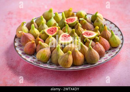 Organic ripe sweet figs on a plate.. Healthy mediterranean fig fruits Stock Photo