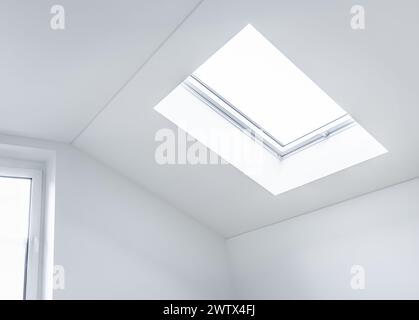Loft refurbishment - empty room with skylight ready for renovation Stock Photo