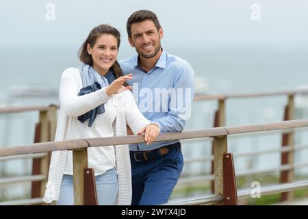 lovers man and woman on a pier on a date Stock Photo