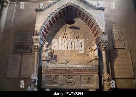 Gothic marble funerary monument to Cardinal Guglielmo Longhi by Ugo da Campione from XIV century in Lombard Romanesque Basilica di Santa Maria Maggior Stock Photo