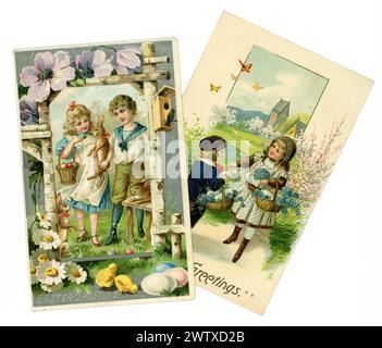Original early American Easter greetings cards. Two children with baskets of Easter eggs. Unposted. U.S.A. Circa 1905 /1910. Stock Photo