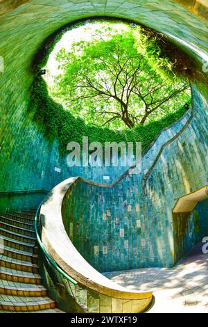 View of a spiral staircase of an underground crossing in tunnel at Fort Canning Park, Singapore Stock Photo