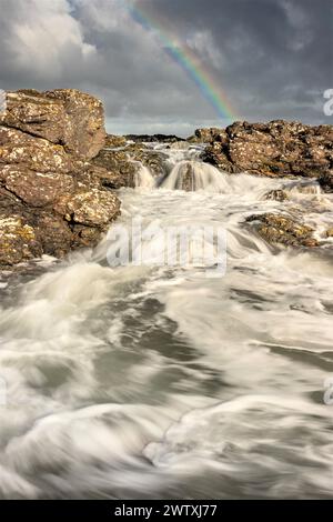 Rainbow at Dunseverick Harbour, Co. Antrim Northern Ireland Stock Photo