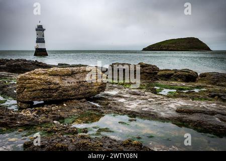Penmon lighthouse close by Puffin island on Anglesey, Ynys Mon North Wales. Stock Photo