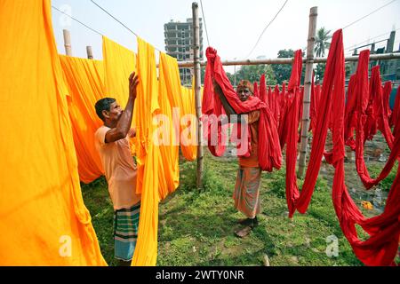 Bangladeshi workers collect fabric after drying them under the sun at a dyeing factory in Narayanganj, near Dhaka, Bangladesh, on March 20, 2024. Photo by Habibur Rahman/ABACAPRESS.COM Stock Photo