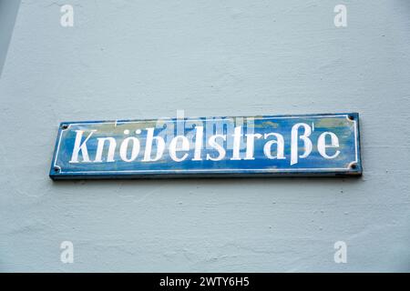 Munich, Germany - December 26, 2021: Street sign in Munich, Bavaria, Germany. Knoelbelstrasse sign. Stock Photo