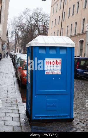 Munich, Germany - December 26, 2021: Portable toilet situated in a street in Munich, Bavaria, Germany Stock Photo