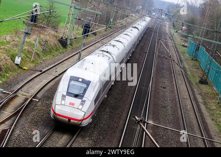 Eschede, Germany. 20th Mar, 2024. An ICE train travels on the railroad line between Hanover and Hamburg. Both sides in the wage dispute at Deutsche Bahn have resumed negotiations. The Group and the train drivers' union GDL are confident of reaching an agreement this week, according to a statement from Deutsche Bahn. Credit: Julian Stratenschulte/dpa/Alamy Live News Stock Photo