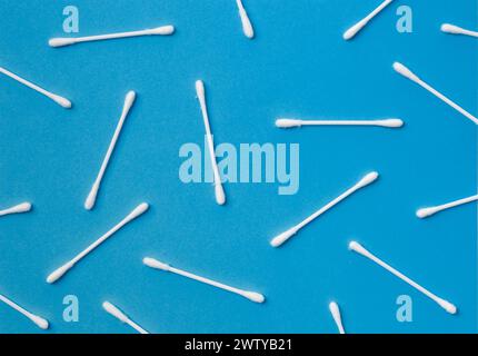 Cotton swabs buds sticks on a blue background. The concept of cleansing, hygiene, medicine, skin care, makeup Stock Photo