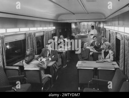 Passengers dining in the lounge car on a train called Super Chief Stock Photo