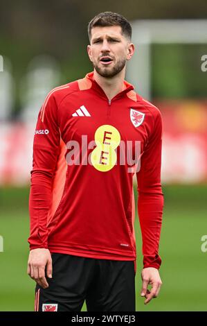 Chris Mepham of Wales during warms up ahead of the Wales open training session at Vale Resort Training complex, Hensol, United Kingdom, 20th March 2024  (Photo by Craig Thomas/News Images) Stock Photo