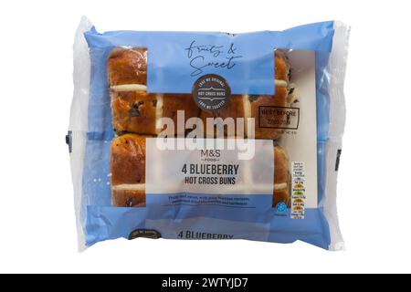 pack of Blueberry Hot Cross Buns from M&S isolated on white - fruity and sweet with juicy Vostizza currants sweetened dry blueberries and cardamon Stock Photo