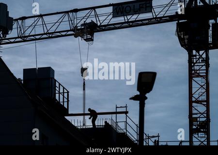 Berlin, Germany. 19th Mar, 2024. A worker is busy on a construction site in Weißensee. According to a new forecast by the economic research institute IMK, the German economy will shrink by 0.3 percent this year. Credit: Soeren Stache/dpa/Alamy Live News Stock Photo