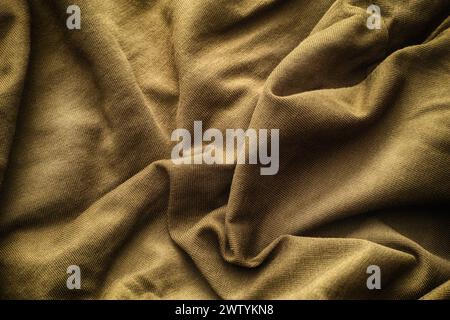 A crumpled beige fabric texture background. Close up. Stock Photo