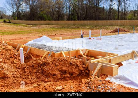 First insulation membrane waterproofing is installed before foundation of house can be poured Stock Photo