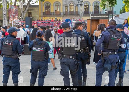 Oaxaca, Mexico - Police officers keep watch outside a youth boxing match in the zocalo. Stock Photo