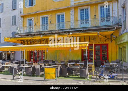Arles, France - January 29, 2016: Famous Yellow Coffee Shop Le Cafe La Nuit Vincent Van Gogh at Place du Forum in Old Town. Stock Photo