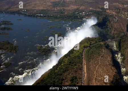 Aerial view of the Zambezi River and thundering Victoria Falls in Zimbabwe, as seen from a helicopter Stock Photo