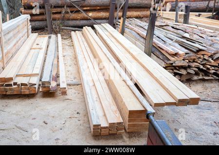 Wooden boards in the sawmill warehouse. Sawing wood Stock Photo