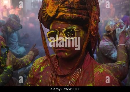 Nandgaon, Uttar Pradesh, India. 19th Mar, 2024. A man's face can be seen covered with different colors as the people of different villages play Lathmar Holi, at a temple in the Nandgaon Village, in the Indian State of Uttar Pradesh, India on March 19, 2024. (Credit Image: © Kabir Jhangiani/ZUMA Press Wire) EDITORIAL USAGE ONLY! Not for Commercial USAGE! Stock Photo