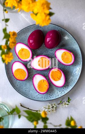 Hard boiled eggs pickled in beetroot juice Stock Photo
