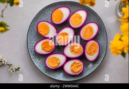 Hard boiled eggs pickled in beetroot juice Stock Photo