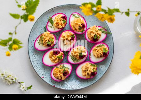 Beetroot pickled devilled eggs, easter canapes Stock Photo