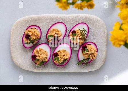 Beetroot pickled devilled eggs, easter canapes Stock Photo