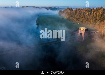 The Union Chain Bridge is a suspended-deck suspension bridge that spans the River Tweed between Horncliffe on English side and Fishwick on the Scottis Stock Photo